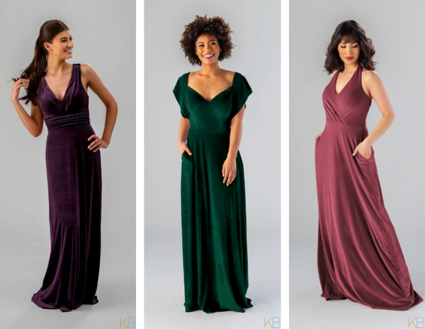 Models in various styles of Kennedy Blue Velvet Bridesmaid Dresses in colors 'Eggplant', 'Emerald', and 'Rosewood'.